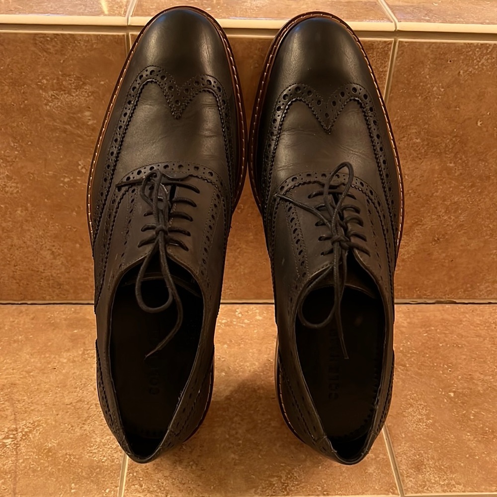 Mens Cole Haan black wing tip saddle shoes; mat not patent